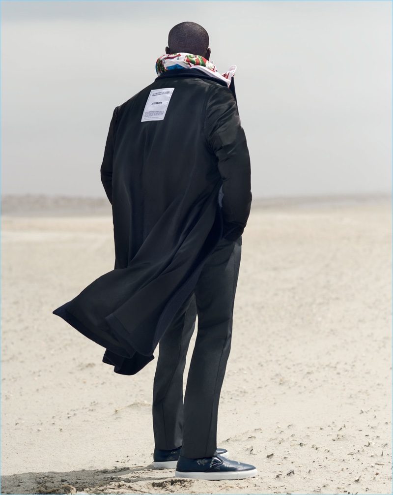 Taking to the beach, Buddy sports Vetements.