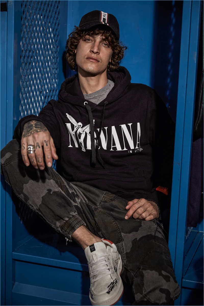 Front and center, Jonathan Bellini wears a Nirvana hoodie from Replay's collection.