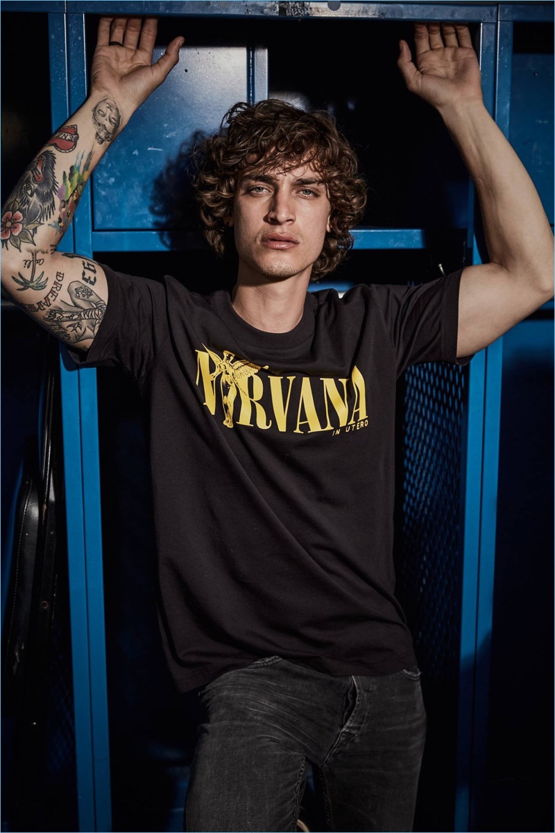 Brazilian model Jonathan Bellini rocks a Nirvana t-shirt from Replay's new collection.