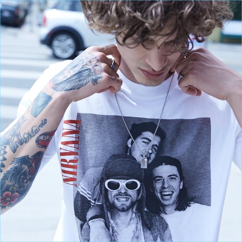 Jonathan Bellini sports a photo print t-shirt from Replay's Nirvana collection.