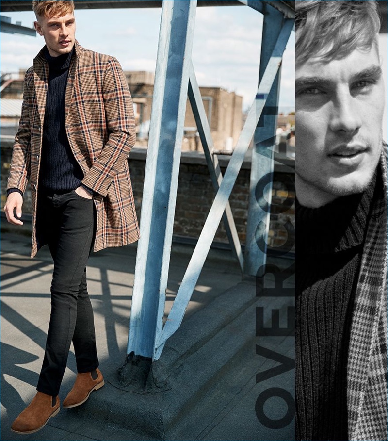 Overcoat: Tommy Marr wears a brown check smart overcoat from River Island.