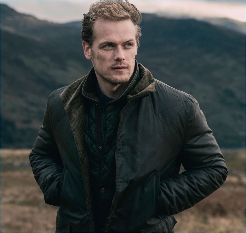 Actor Sam Heughan sports a waxed cotton jacket from his Barbour collaboration.