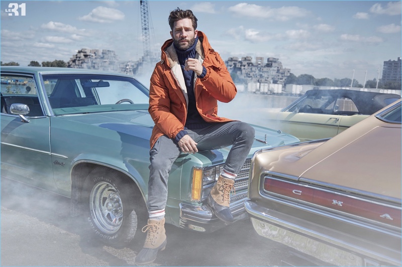 Embracing a rugged ease, John Halls sports a Holubar parka, LE 31 turtleneck sweater, and Sorel boots.