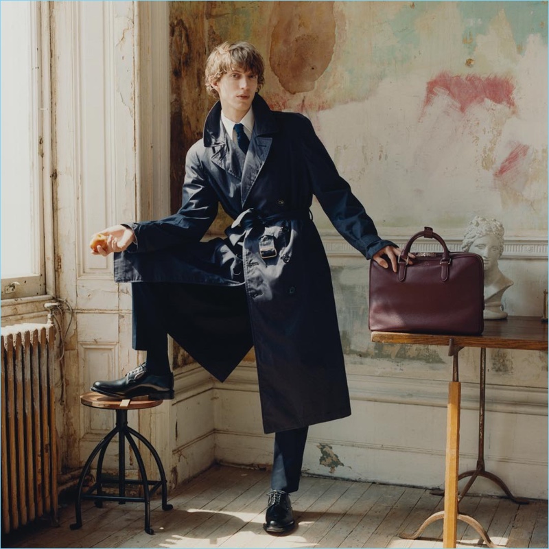 Fronting Smythson's fall-winter 2018 campaign, Xavier Buestel poses with the brand's Burlington slim briefcase in oxblood.