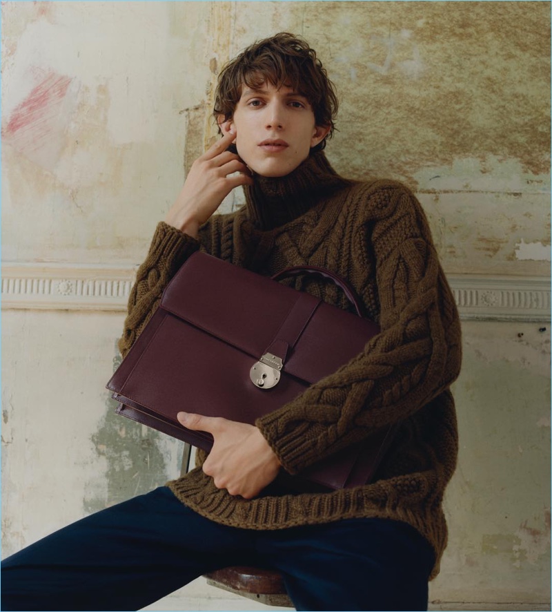 Xavier Buestel takes hold of Smythson's oxblood-colored briefcase for the brand's fall-winter 2018 campaign.