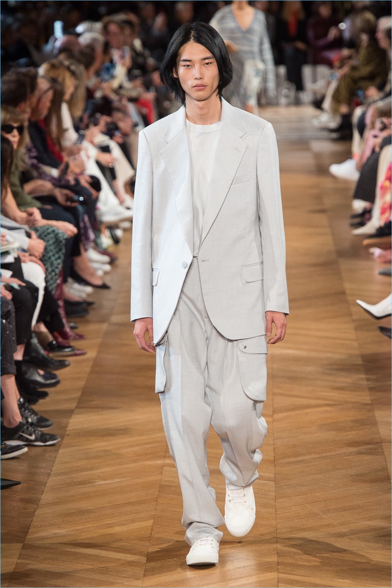 Park Tae Min dons neutral colored tailoring from Stella McCartney's spring-summer 2019 men's collection.