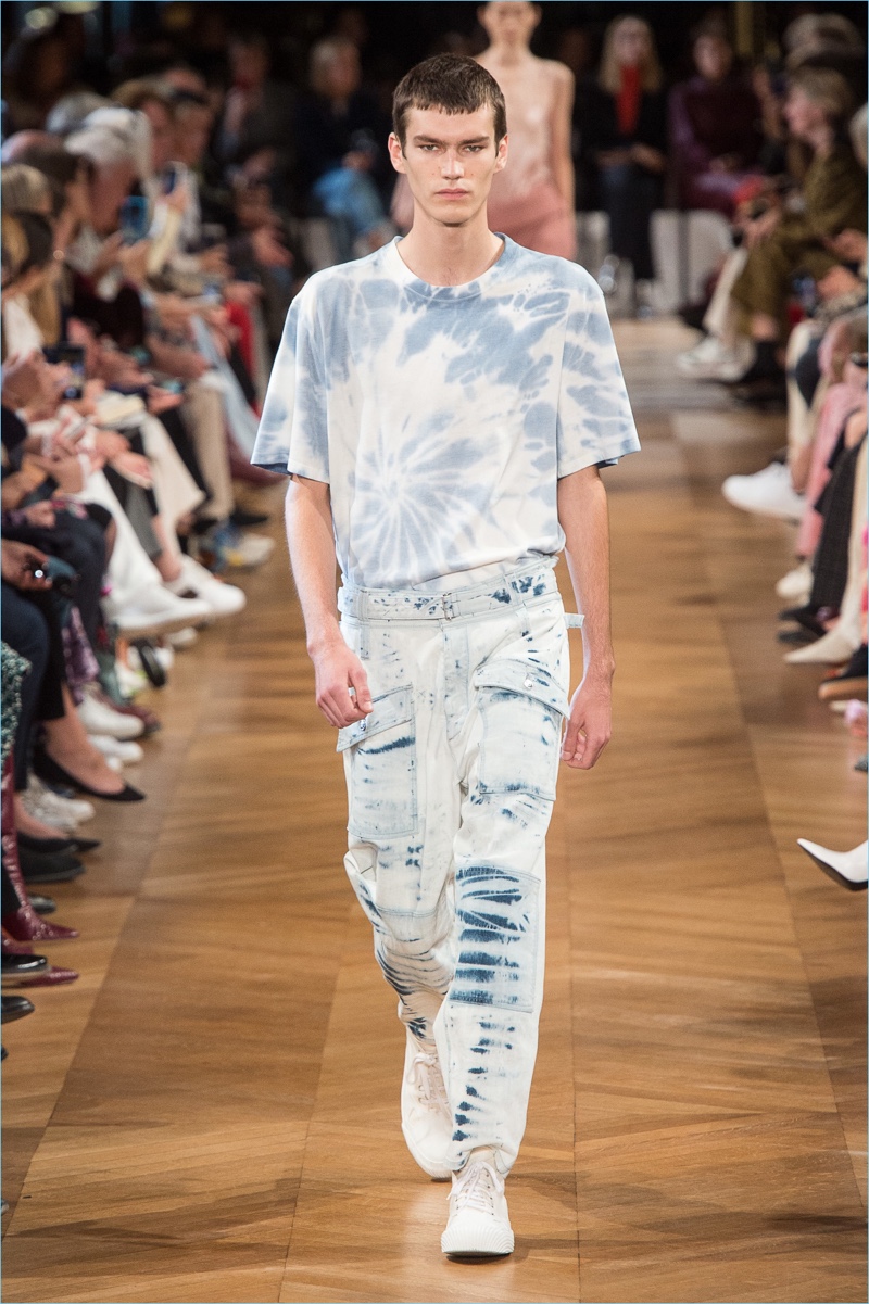 Elias de Poot wears a tie-dye look from Stella McCartney's spring-summer 2019 men's collection.