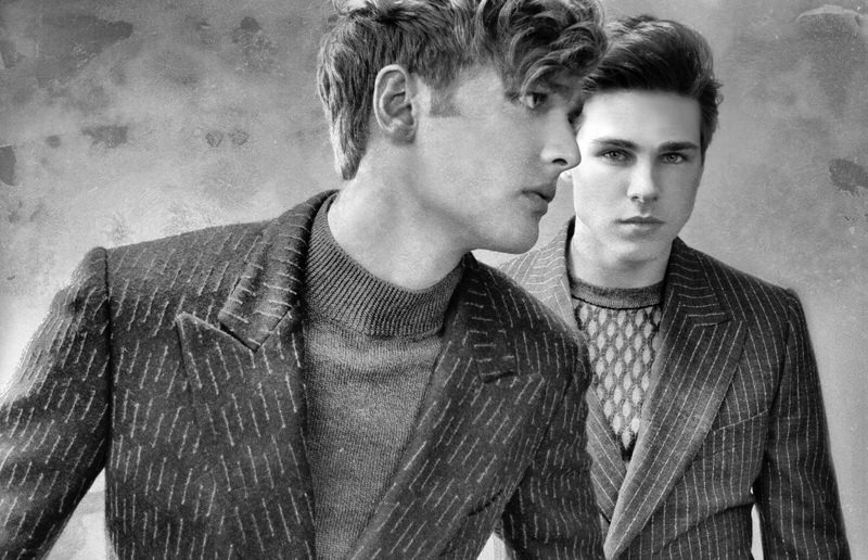 Austen Dickinson and Alex D'Orazio wear sweaters and jackets Christopher Bates.