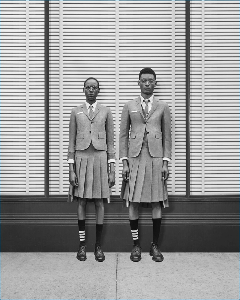 Models Ajak Deng and Youssouf Bamba sport fall-winter 2018 looks by Thom Browne.