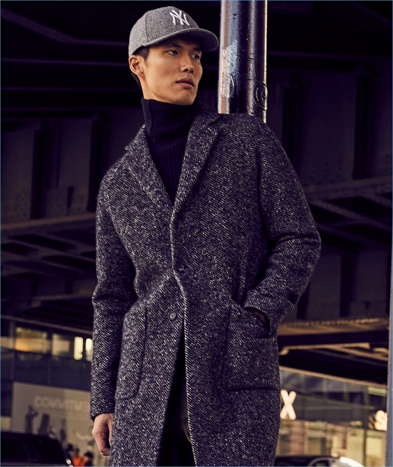 Dae Na sports an Italian wool bouclé herringbone topcoat from Todd Snyder.