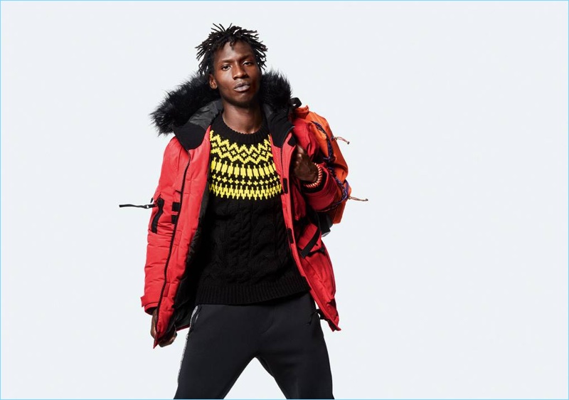 Adonis Bosso sports a red parka for Topman's fall-winter 2018 campaign.