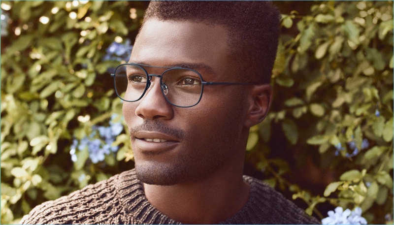 A smart vision, Remi Alade-Chester wears Warby Parker's George glasses in brushed navy.