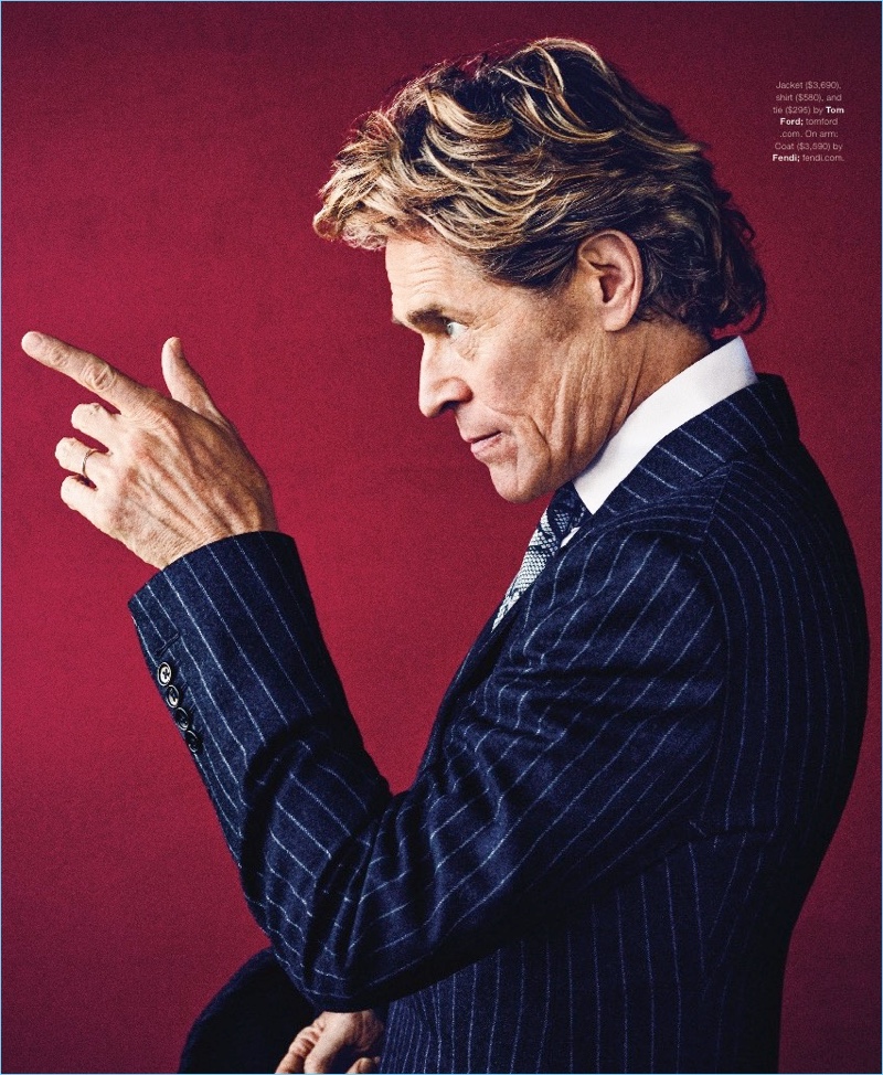 Actor Willem Dafoe wears a jacket, shirt, and tie by Tom Ford.