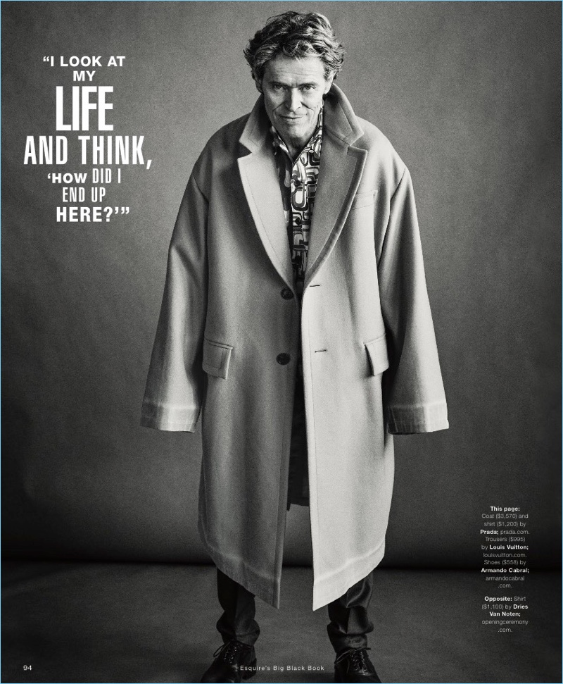 Embracing oversized style, Willem Dafoe dons a Prada coat and shirt. He also wears Louis Vuitton trousers and Armando Cabral shoes.