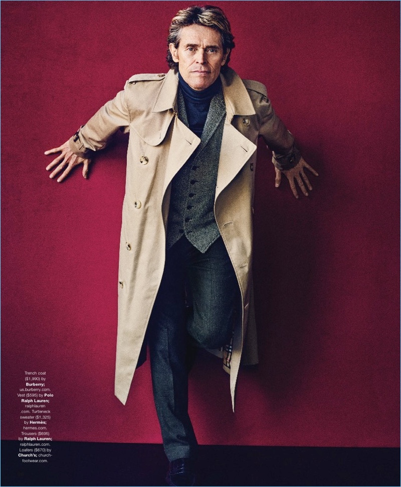 Front and center, Willem Dafoe wears a Burberry trench, POLO Ralph Lauren vest, Hermès turtleneck sweater, and Ralph Lauren trousers. Church's shoes complete Dafoe's look.