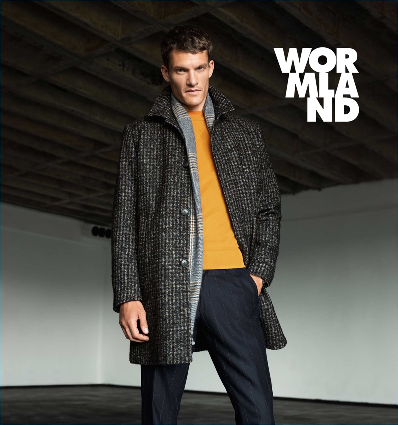 A sharp vision, Danny Beauchamp dons a Wormland coat and scarf with a Drykorn pullover.