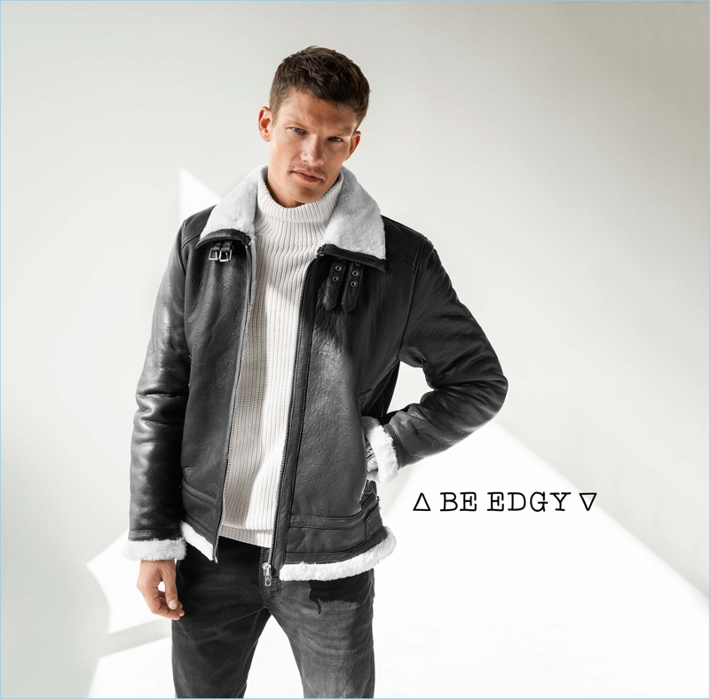 Embracing cool style, Danny Beauchamp wears a Be Edgy leather jacket with a Drykorn turtleneck sweater.