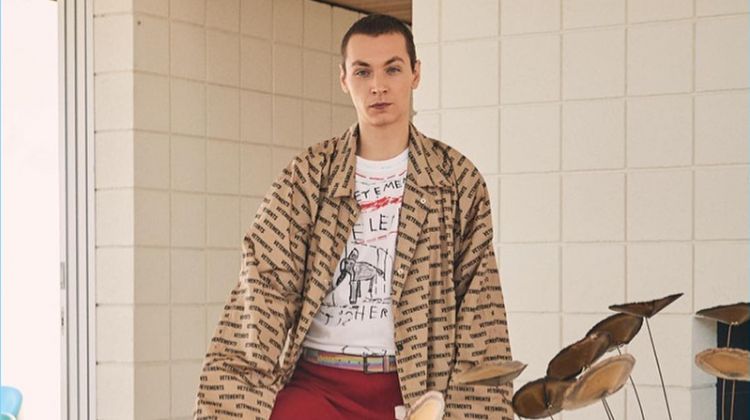 Embracing the oversized trend, Yuri Pleskun sports a Vetements car coat, logo sweatpants, and an Elephant Marta tee.