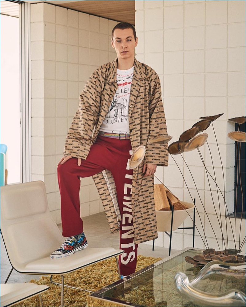 Embracing the oversized trend, Yuri Pleskun sports a Vetements car coat, logo sweatpants, and an Elephant Marta tee.