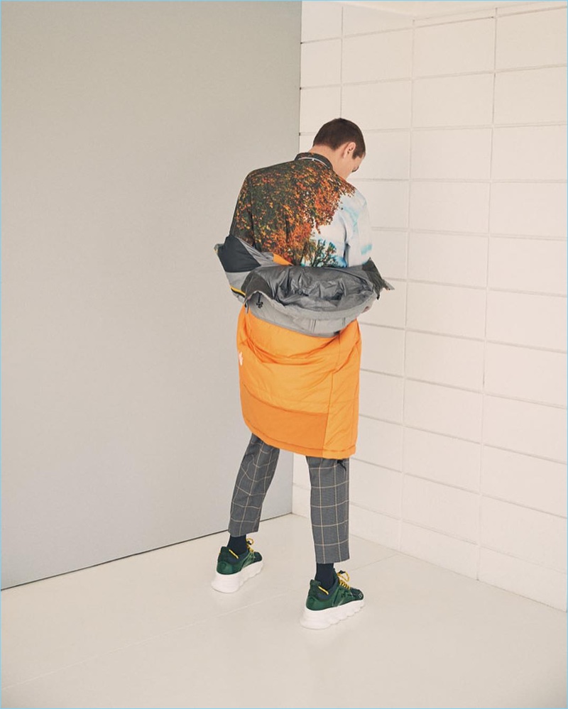 Connecting with FWRD, Yuri Pleskun rocks an OAMC shirt and cropped windowpane print pants with a Junya Watanabe x The North Face parka.