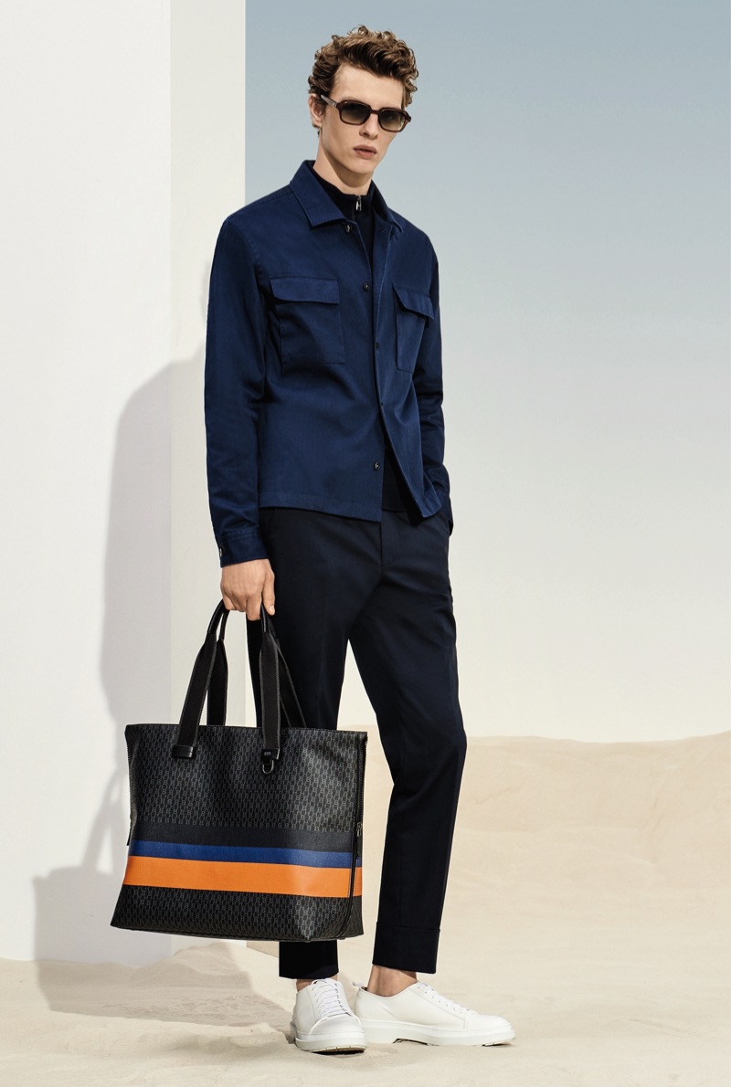 Tim Schuhmacher sports a navy and black look from BOSS' spring-summer 2019 collection.