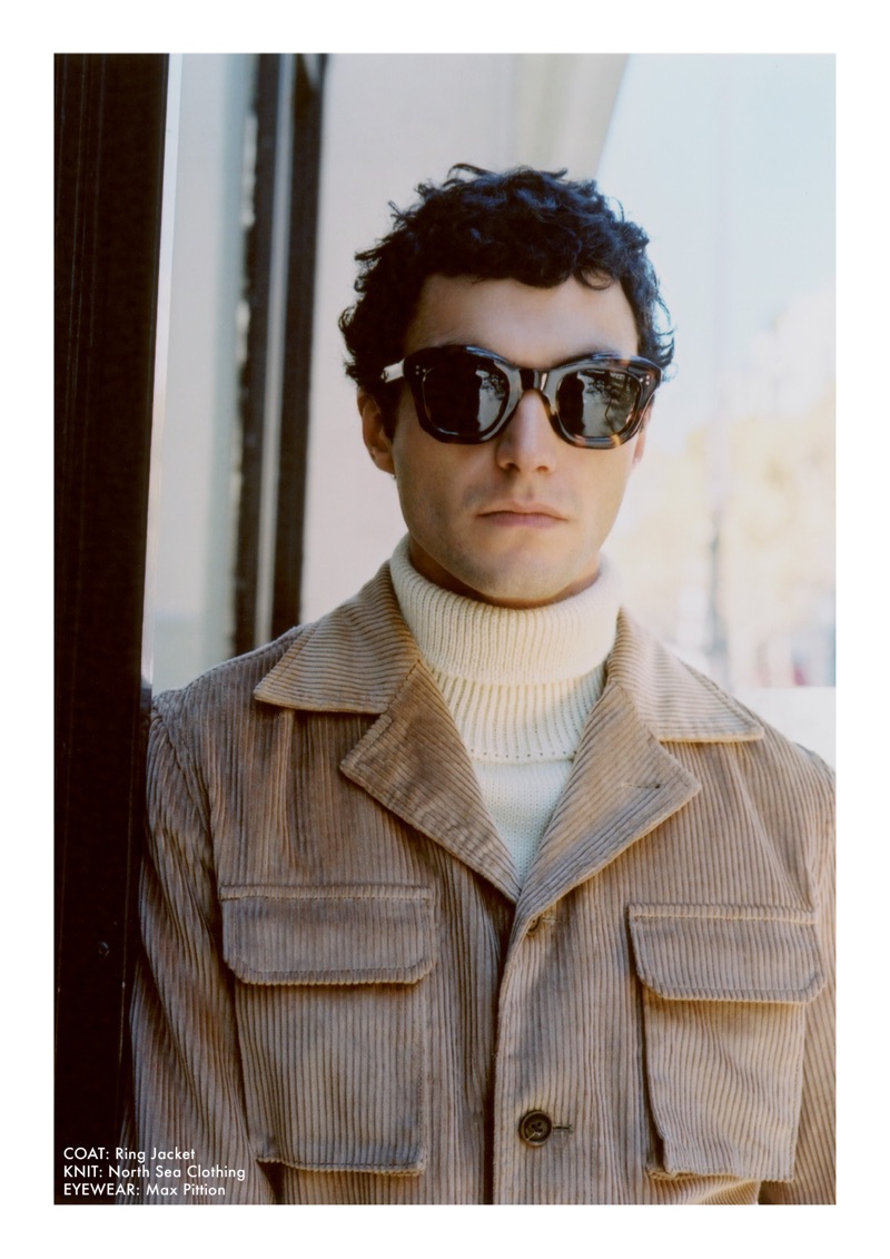 Reuniting with Beige, Dylan Ézékiel Nelson dons a corduroy coat by Ring Jacket with a North Sea Clothing turtleneck sweater and Max Pittion sunglasses.