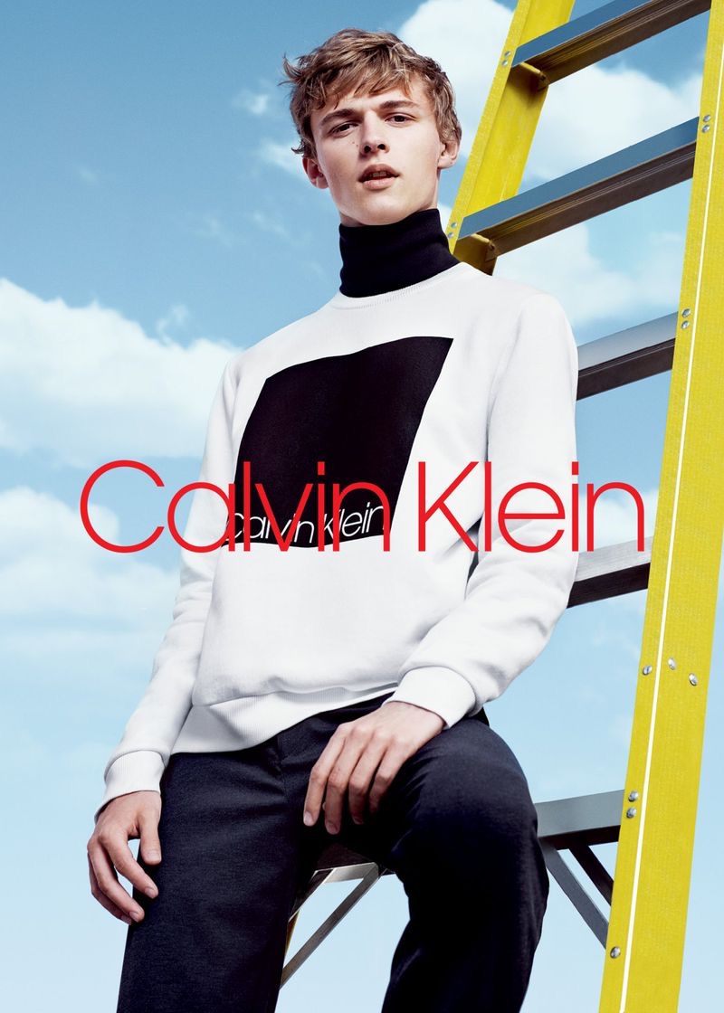 Sporting a black turtleneck and logo sweatshirt, Max Barczak fronts Calvin Klein's fall-winter 2018 men's campaign.