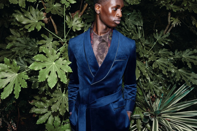 Junior Choi wears a Charlie Casely-Hayford x Topman navy belted smoking jacket.