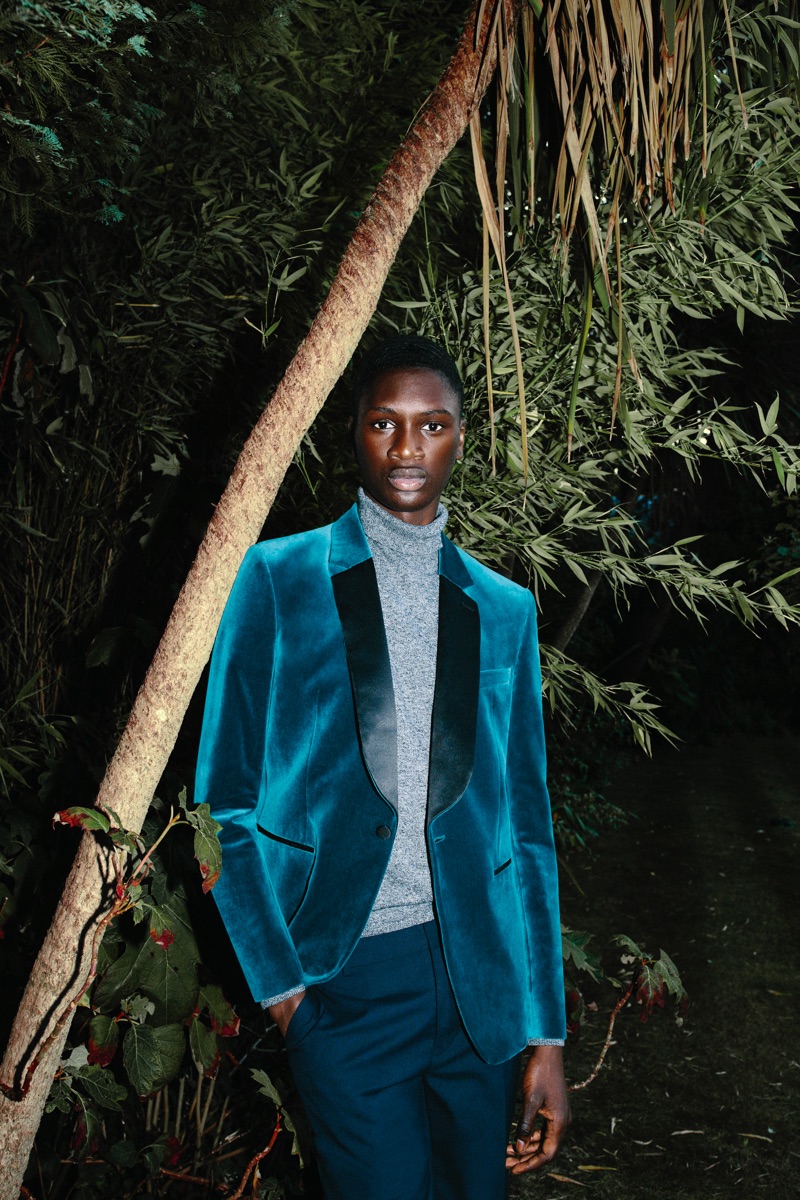 Dressed to impress, Junior Choi dons a Charlie Casely-Hayford x Topman teal velvet blazer with navy trousers.