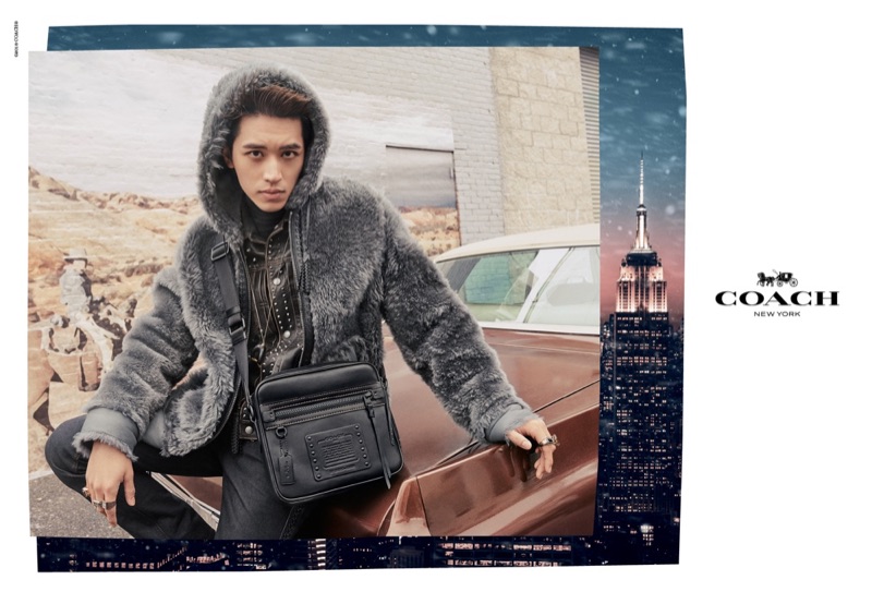 Timmy Xu dons a reversible shearling hoodie in dark grey for Coach's holiday 2018 campaign.