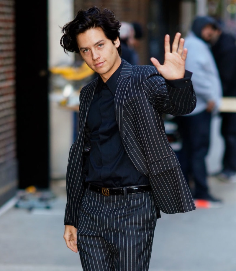 October 2018: Cole Sprouse wears a Versace pinstripe suit in New York City.