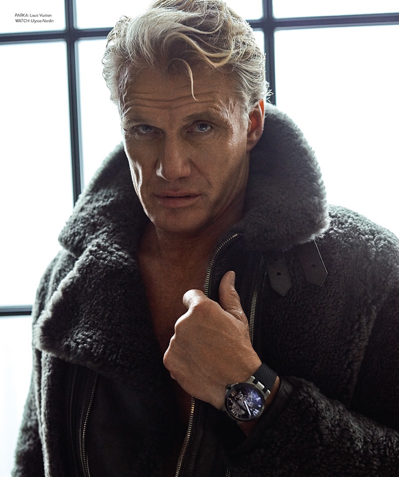 Front and center, Dolph Lundgren sports a Louis Vuitton parka with a Ulysse Nardin watch.