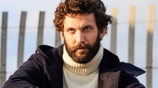 Pile It On: David Enrico Dons Rugged Style for East Dane David Enrico dons a POLO Ralph Lauren turtleneck sweater and duffle coat with Stüssy pants.