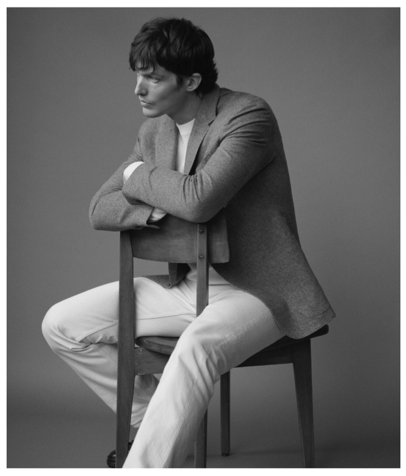 Sitting for a portrait, Michael Gandolfi wears Ermenegildo Zegna.