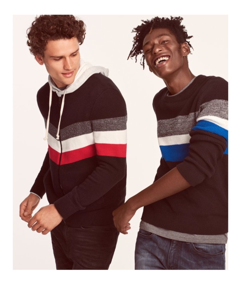 Models Simon Nessman and Shenai Gist sport color blocked sweaters from Express.