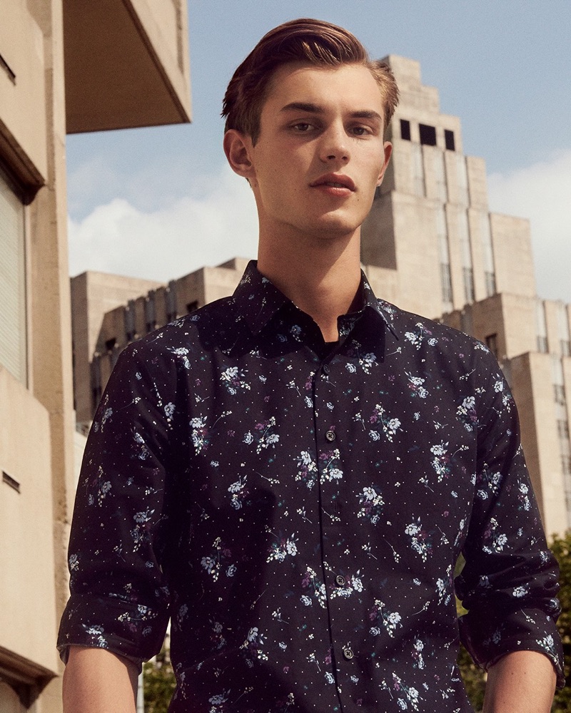 British model Kit Butler wears a slim-fit floral print dress shirt from Express.