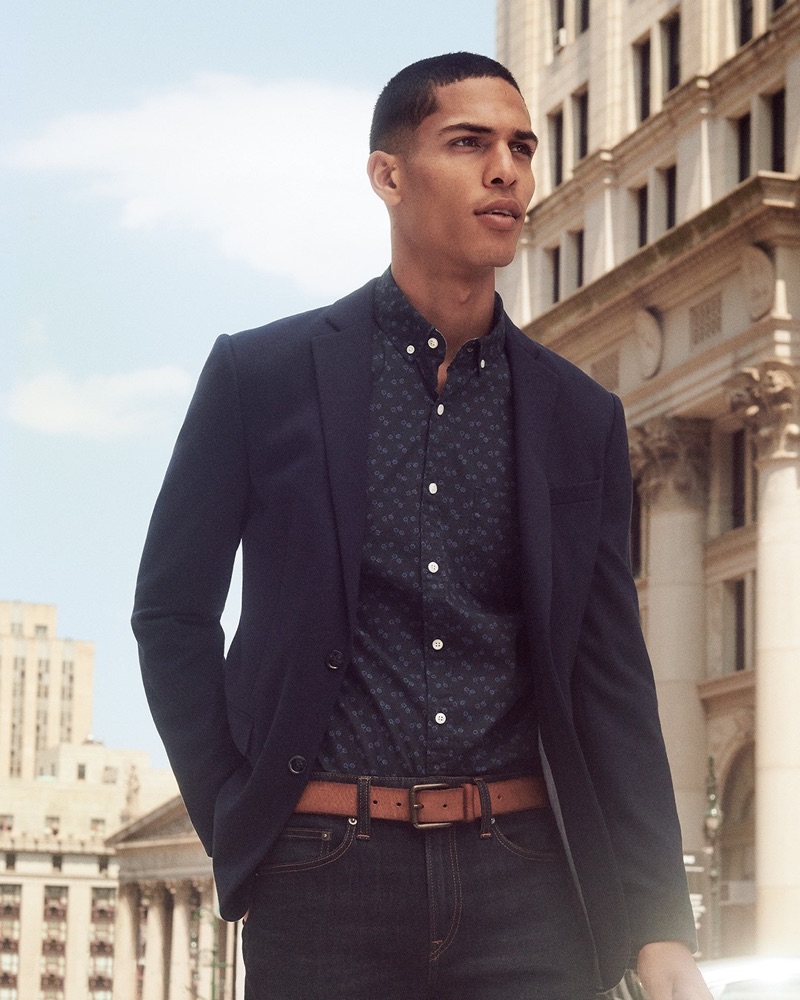 A smart vision, Geron McKinley models a micro-print shirt with a navy blazer and brown leather belt from Express.