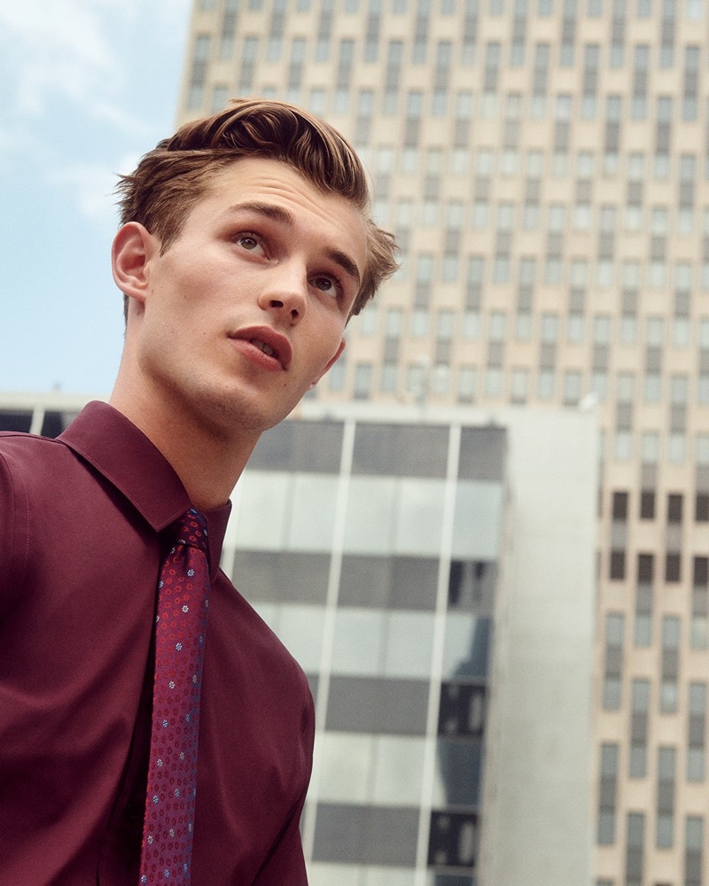 Making a case for burgundy, Kit Butler wears an Express slim solid wrinkle-resistant performance dress shirt with a floral print tie.