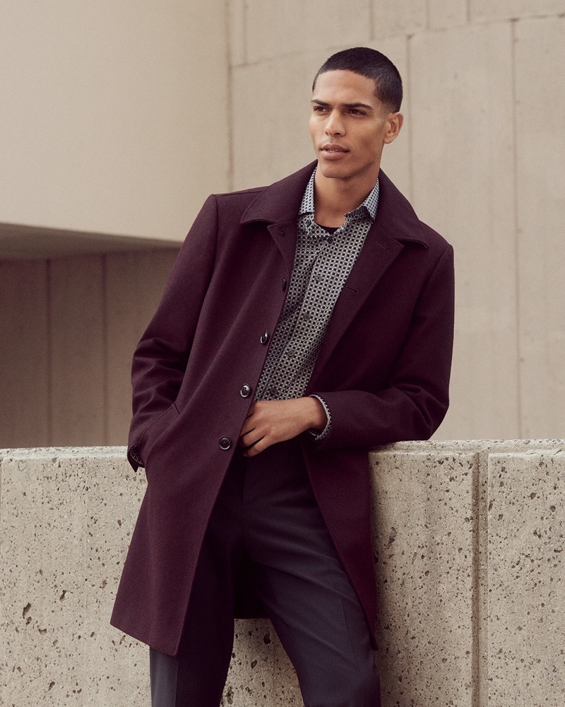 Geron McKinley wears a sleek burgundy recycled wool-blend topcoat by Express.