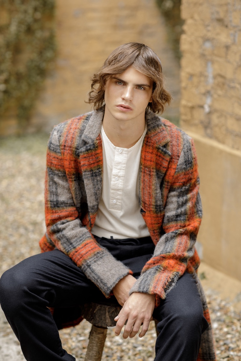 Kit wears checked coat Scotch & Soda, henley Lee Cooper, and trousers You Must Create.