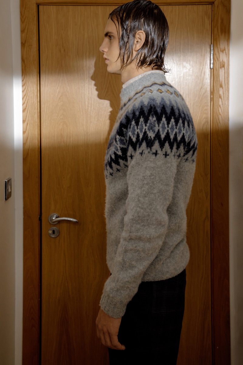 Kit wears sweater Norse Projects, shirt Filippa K, and trousers Simon Carter.