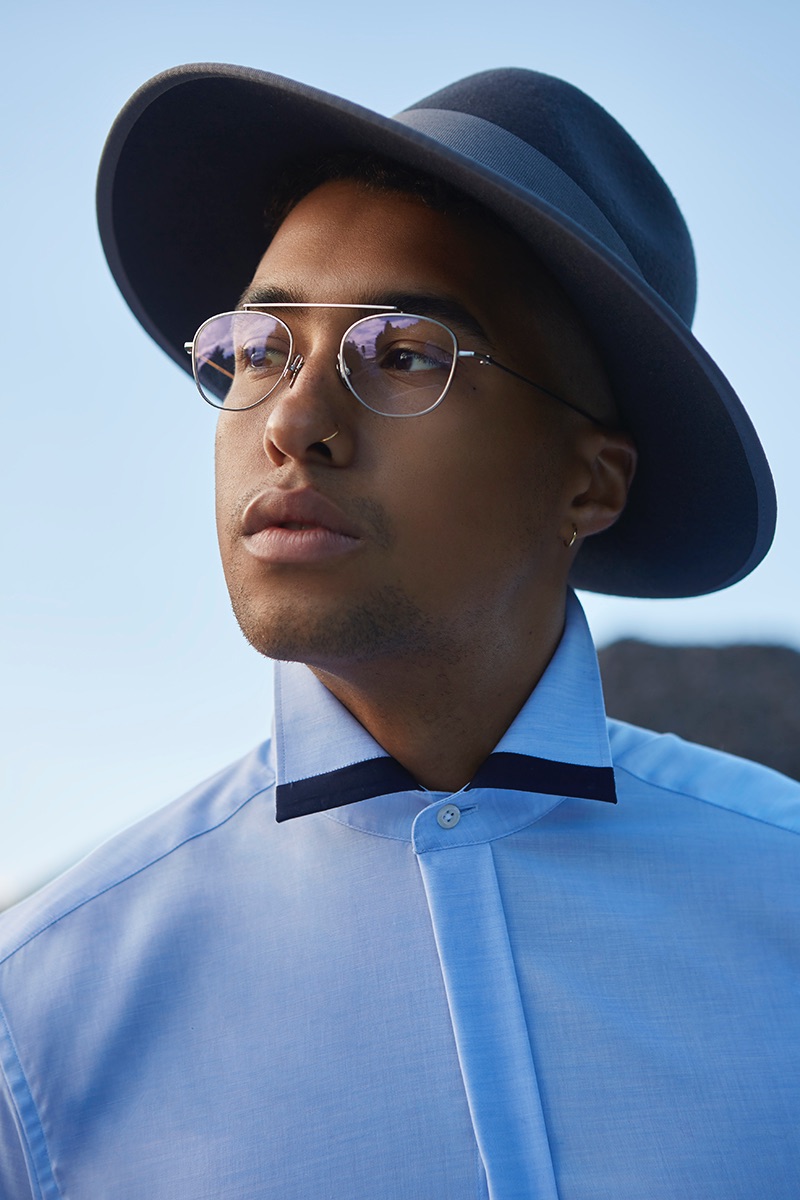 Isak wears shirt Eterna, hat Thomas Rath, and glasses Komono.