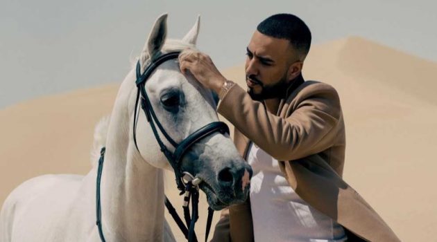 French Montana Travels the World with GQ Middle East Enjoying a GQ moment, French Montana dons a Theory coat, Calvin Klein tank, Off-White track pants, and Fendi sliders.