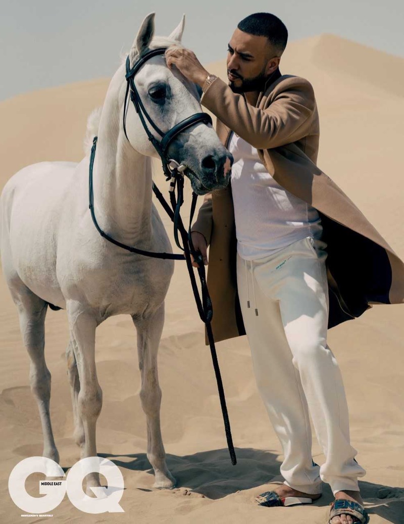 Enjoying a GQ moment, French Montana dons a Theory coat, Calvin Klein tank, Off-White track pants, and Fendi sliders. » French Montana Travels the World with GQ Middle East Enjoying a GQ moment, French Montana dons a Theory coat, Calvin Klein tank, Off-White track pants, and Fendi sliders.