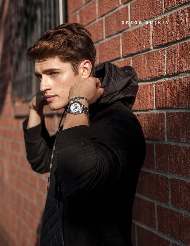 Ready for his close-up, Gregg Sulkin wears a Valentino hooded pullover.