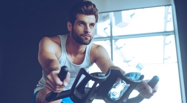 5 Great Gym Outfits That Also Work for Outdoor Adventures Guy working out in cycling shorts