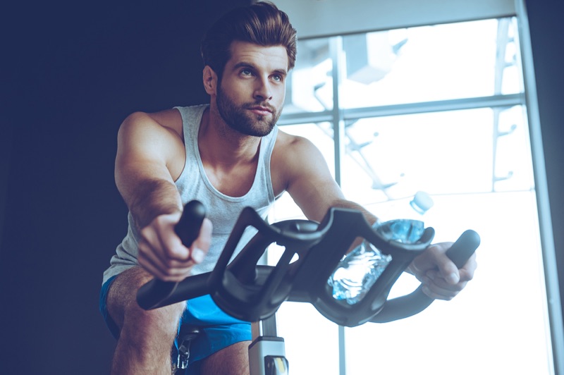 Guy working out in cycling shorts