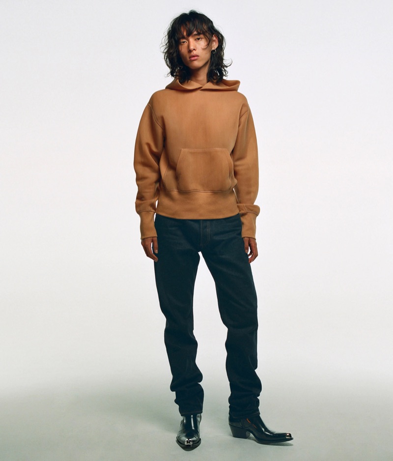 Going casual, David Yang wears a hoodie from Helmut Lang.