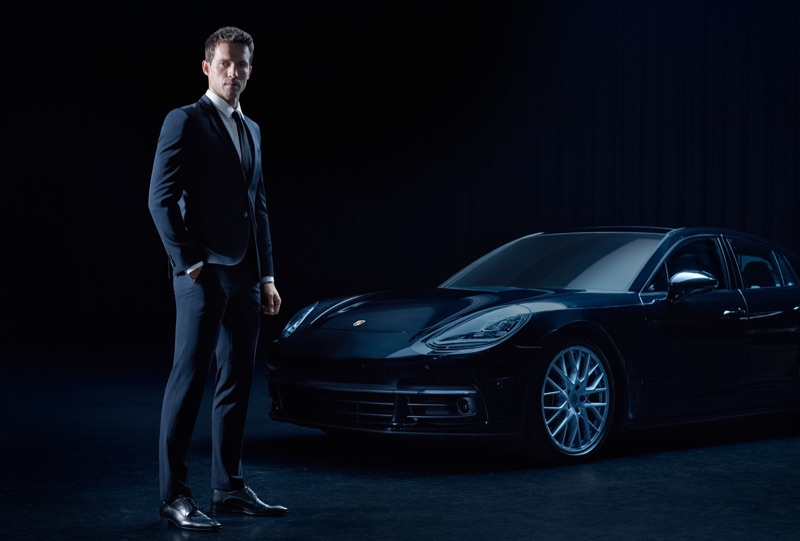 Standing tall, Andrew Cooper sports a look from the upcoming Porsche x BOSS capsule collection. » Hugo Boss & Porsche Collaborate, Preview New Capsule Collection Standing tall, Andrew Cooper sports a look from the upcoming Porsche x BOSS capsule collection.