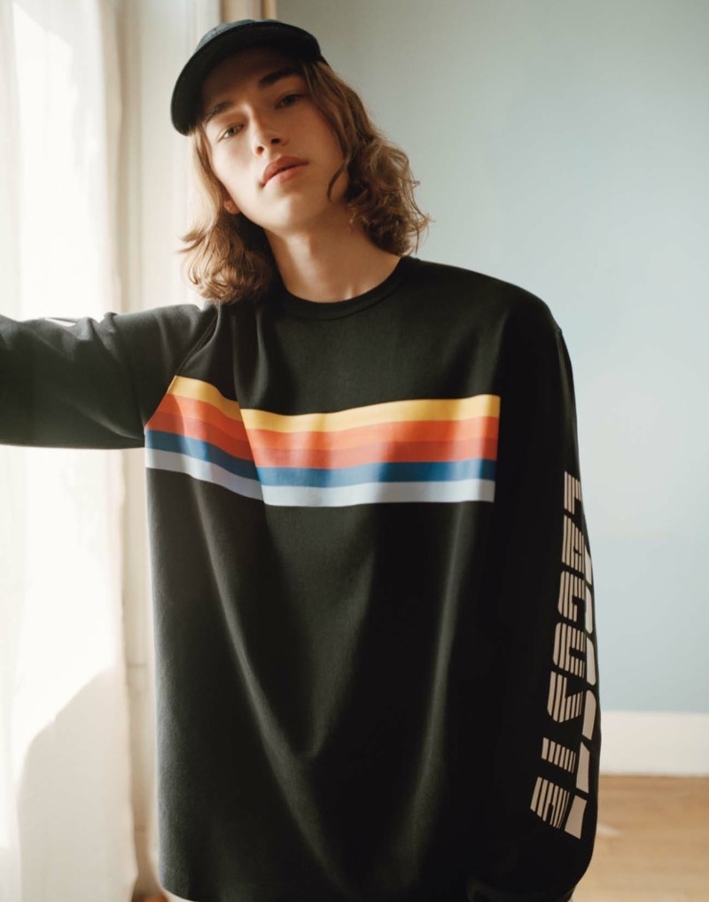 Freddie Ashcroft wears a sporty pullover from Lacoste L!ve's spring-summer 2019 collection.